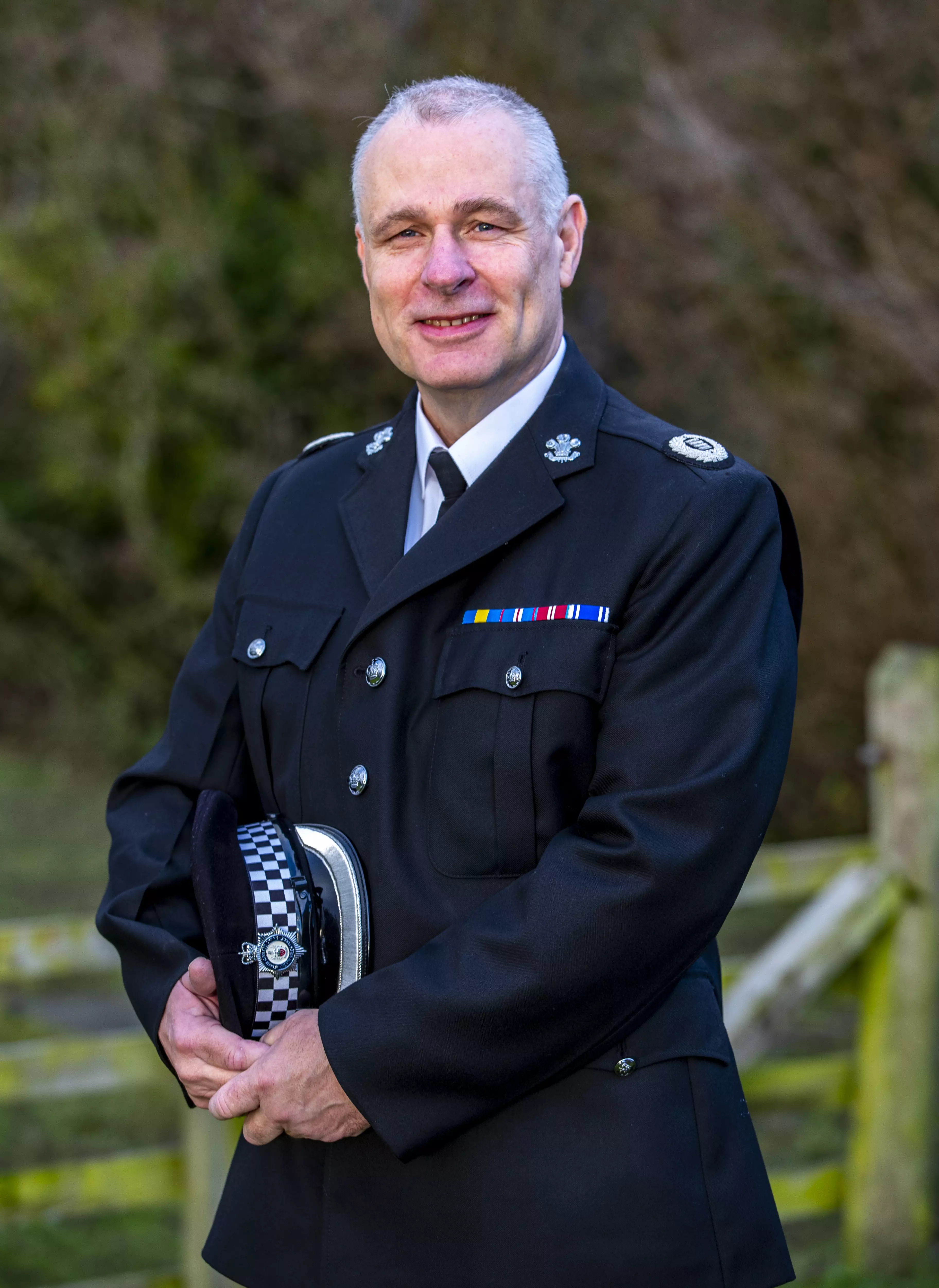 Retired police officer Mark Owen has also accepted an MBE (