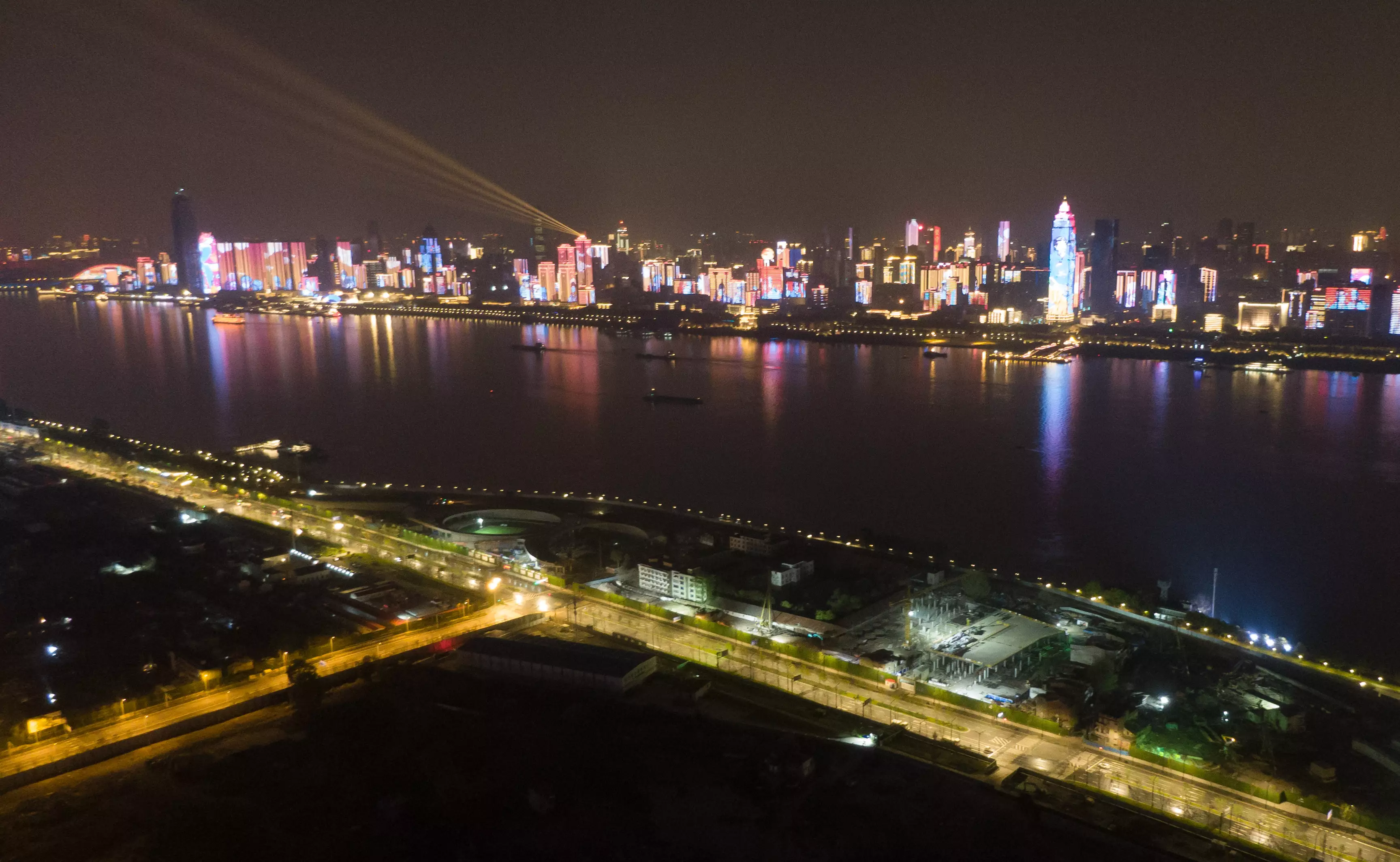 Aerial photo taken on 8 April, 2020 shows illuminated buildings in Wuhan.