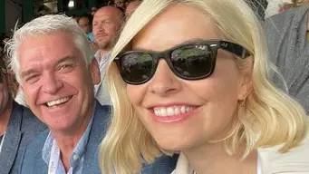 Holly and Phil sat next to each other at the tennis (