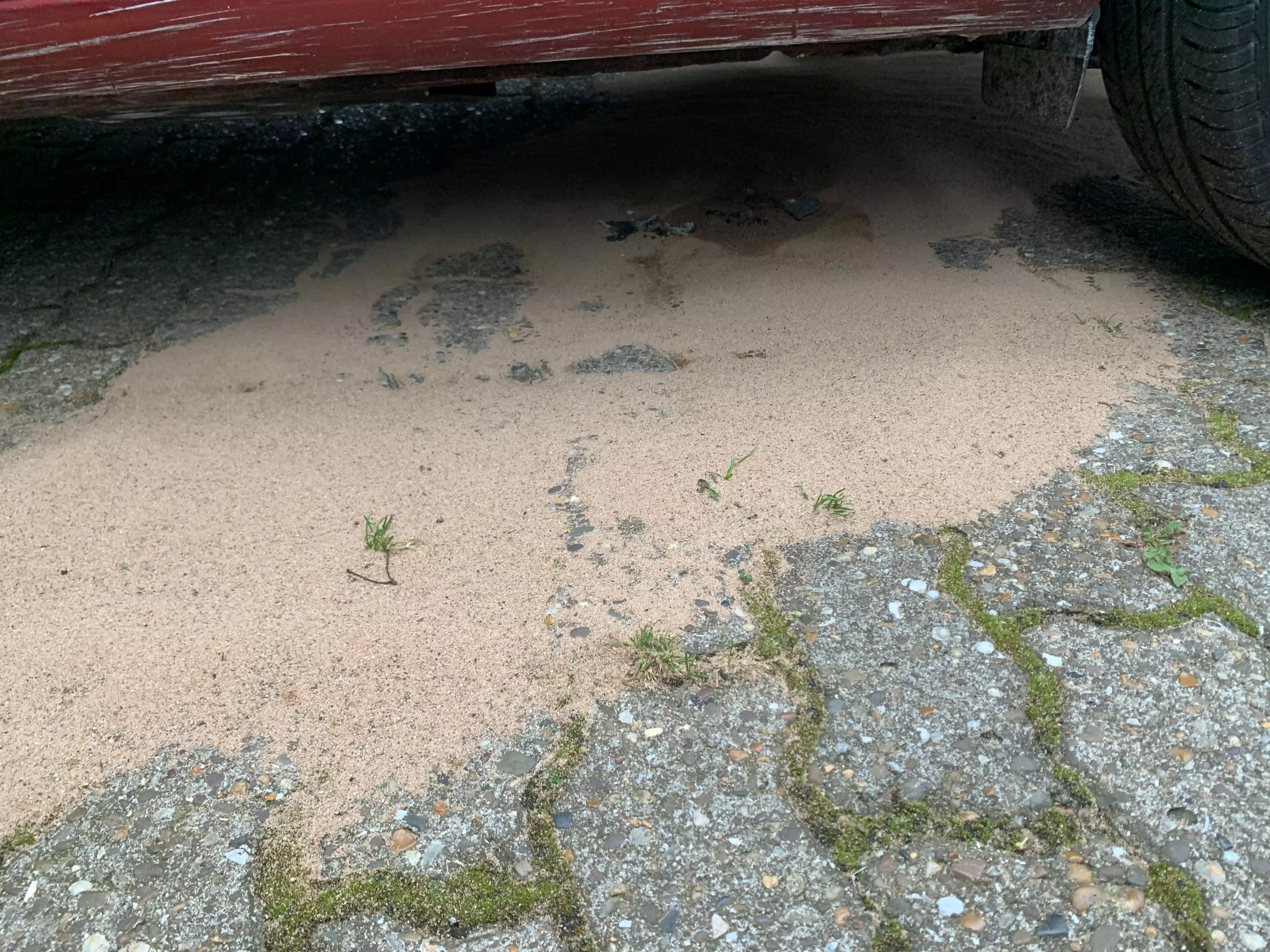 There was a puddle underneath the car.