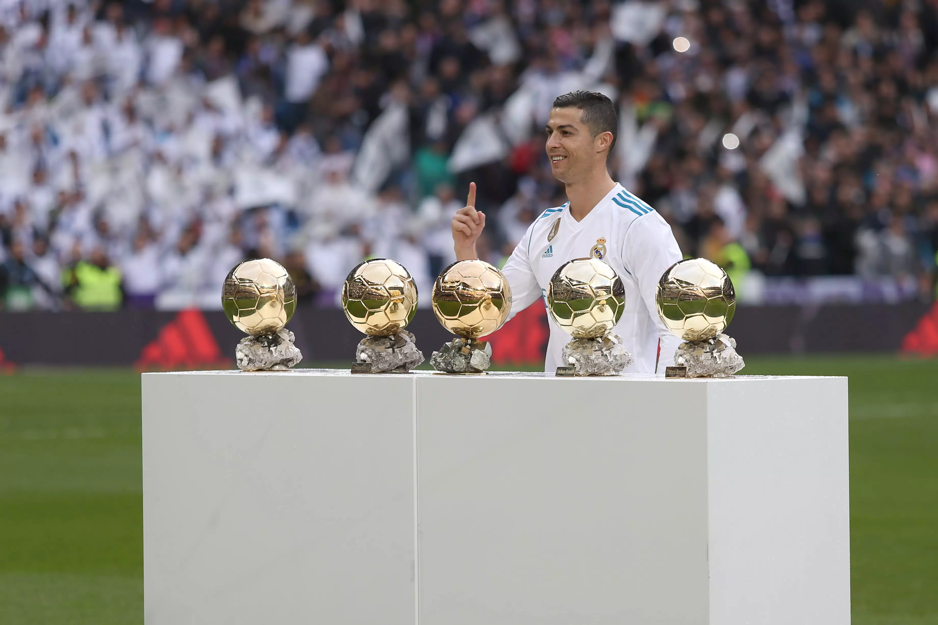 Cristiano shows off his five awards. Image: PA Images