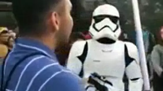 Lightsaber-Wielding Star Wars Fan Rinsed By Stormtrooper At Disneyland.