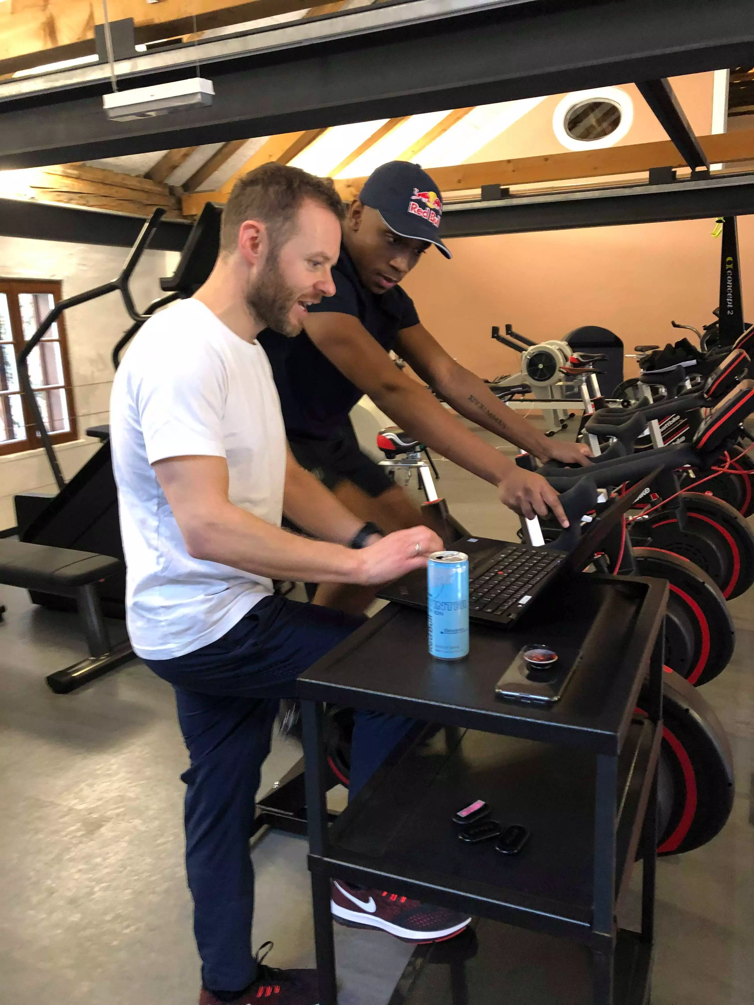 Pessoa being shown part of his training regime by trainer Mark Waldhuber while on the exercise bike. 
