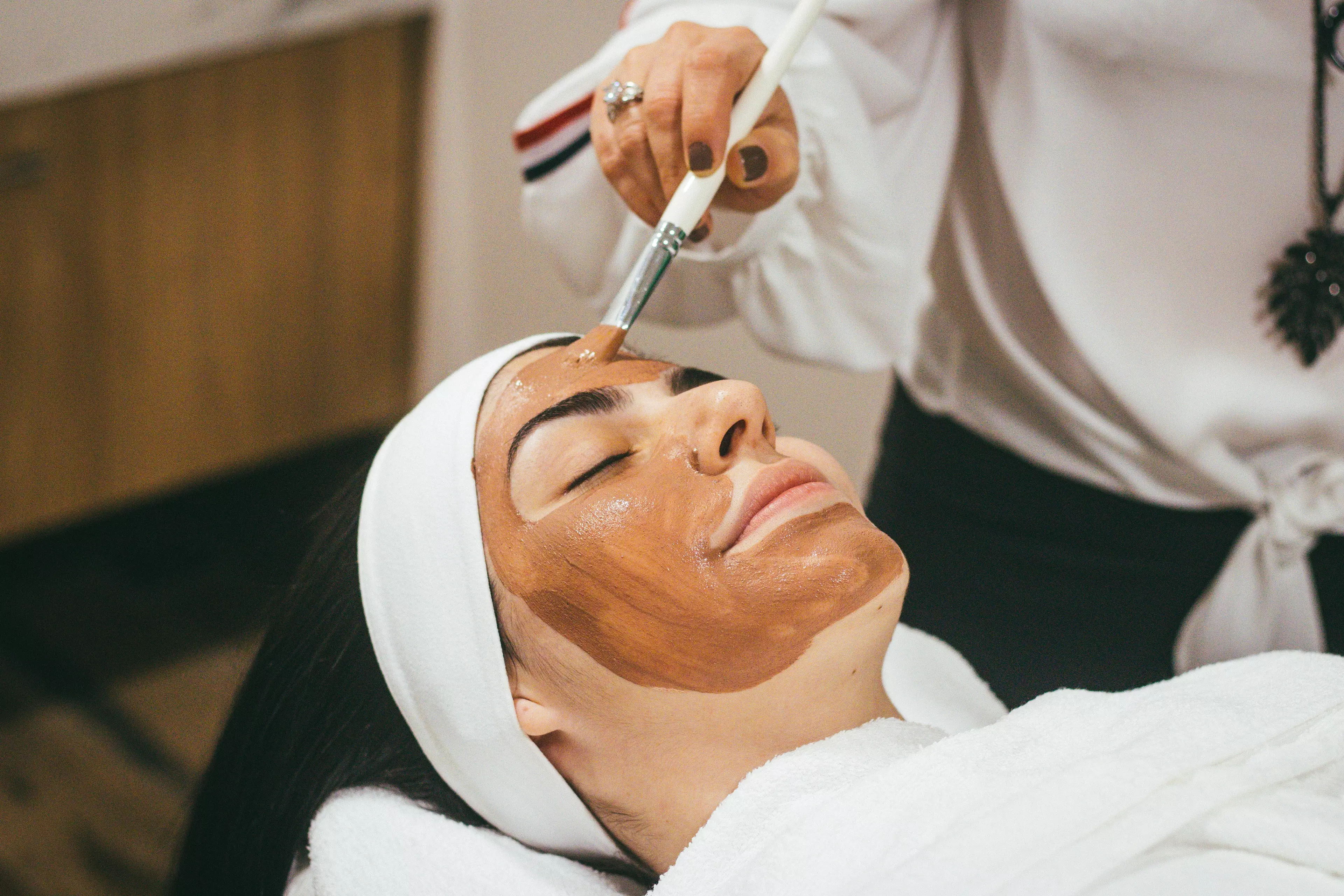 Anything classed as a facial treatment is still prohibited under government guidelines (