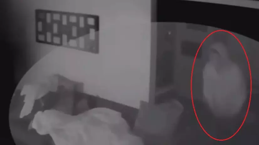 Chilling Footage Shows Intruder Standing Over Sleeping Teen