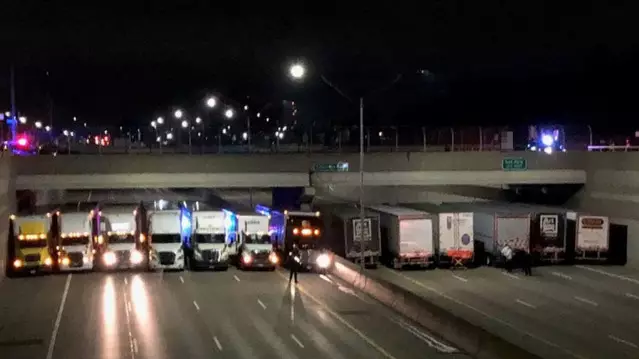 A Fleet Of Truck Drivers Help Stop Man From Jumping From Overpass