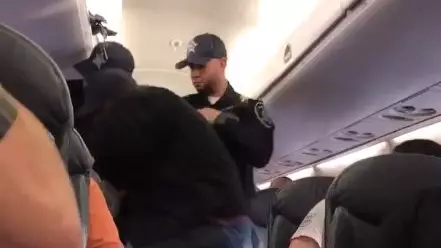 Authorities Drag Doctor Off United Airlines Flight In Shocking Video
