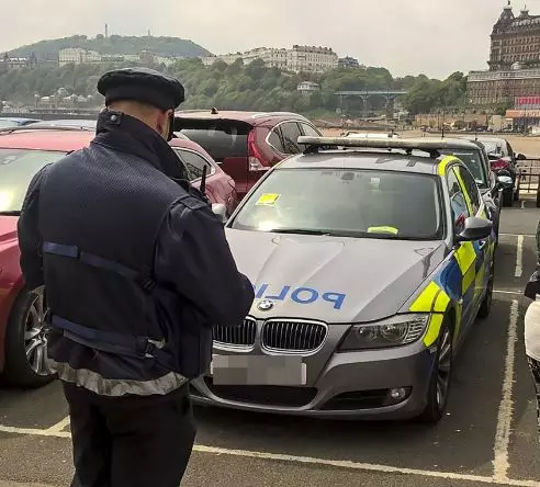 Crowd Cheer As Traffic Warden Slaps Parking Ticket On Police Vehicle  