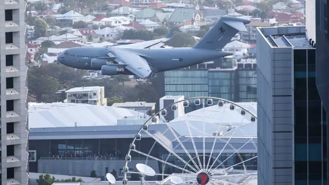 Huge Cargo Plane Weaves In And Out Of Skyscrapers For Brisbane Festival