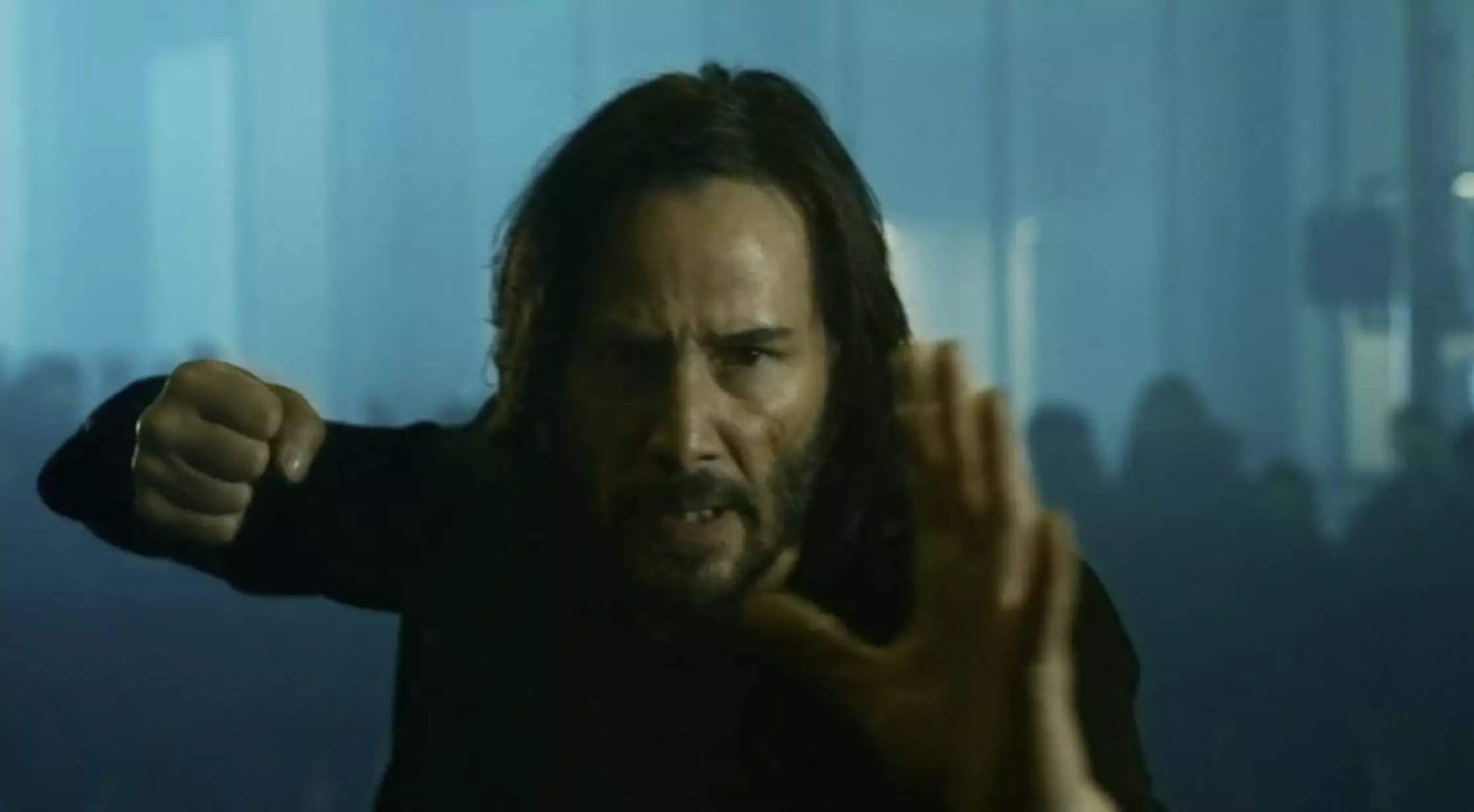 Keanu Reeves reprising his role as Neo.