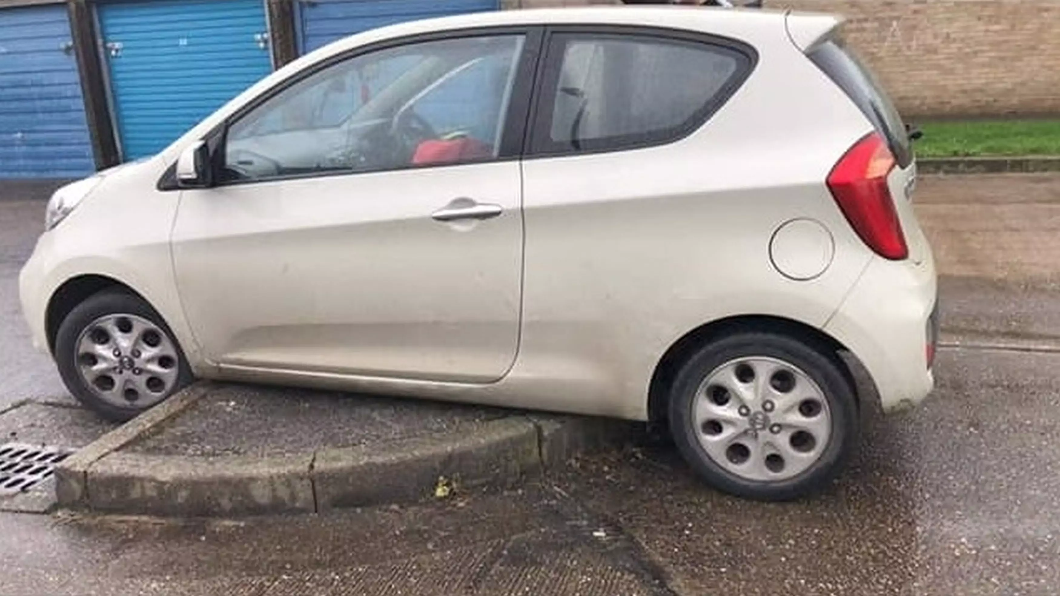 Man Gets His Car Wedged Onto Kerb For An Hour While Delivering Food