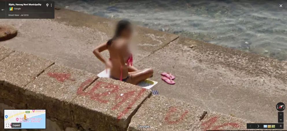 Do you need help with that? Woman Tries To Cover Up From Google Maps camera.