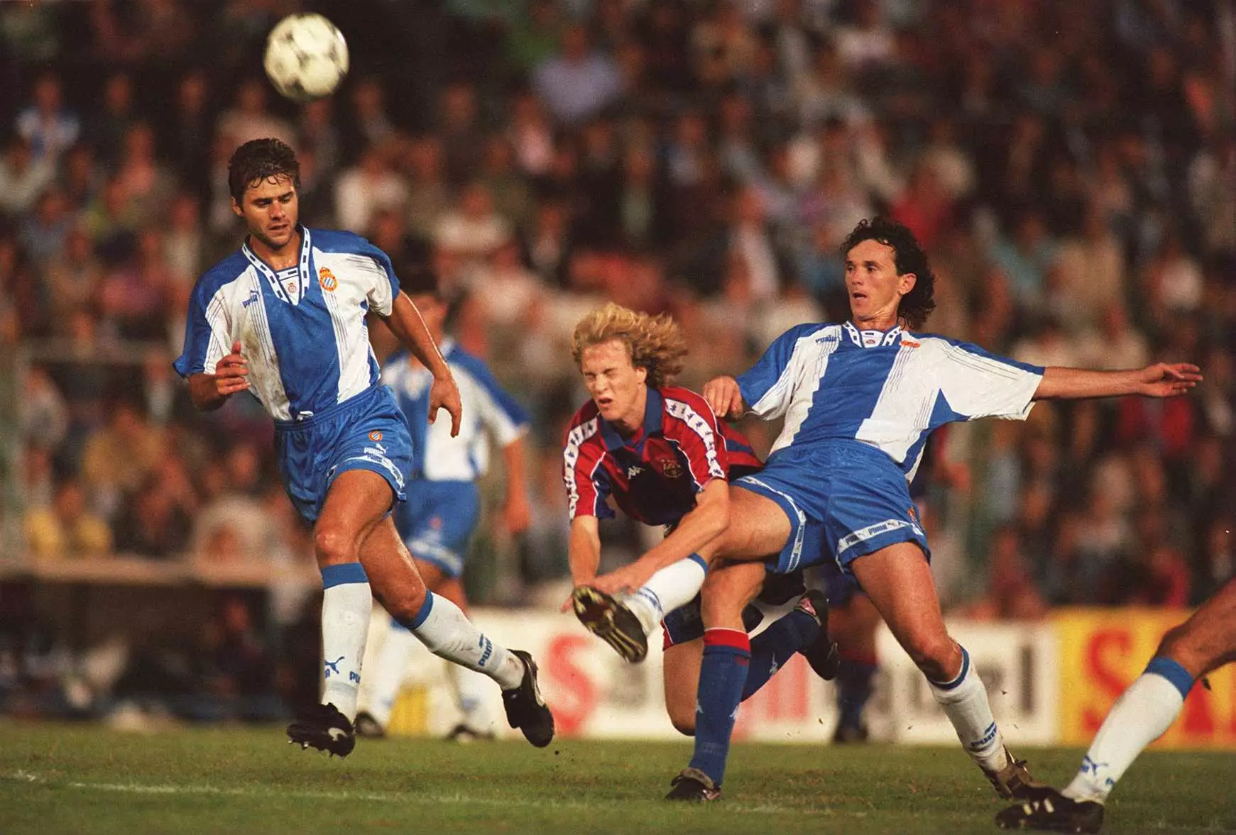 Pochettino, far left, playing against Barca for Espanyol. Image: PA Images