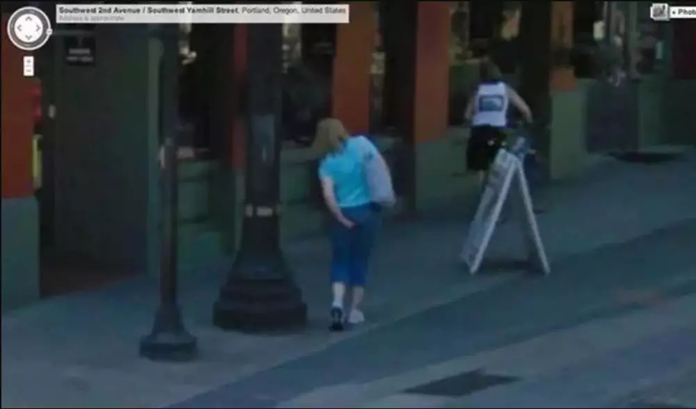 This woman appears to be pulling out a wedgie on camera.