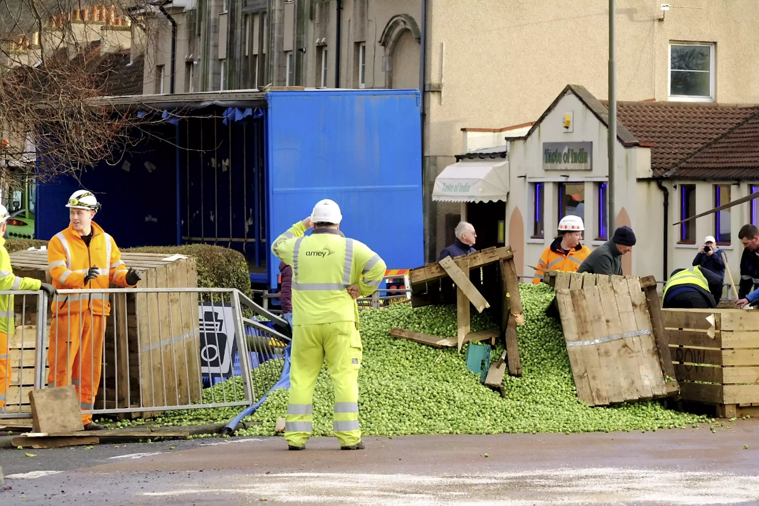 The road was closed as workers cleaned away the sprouts (