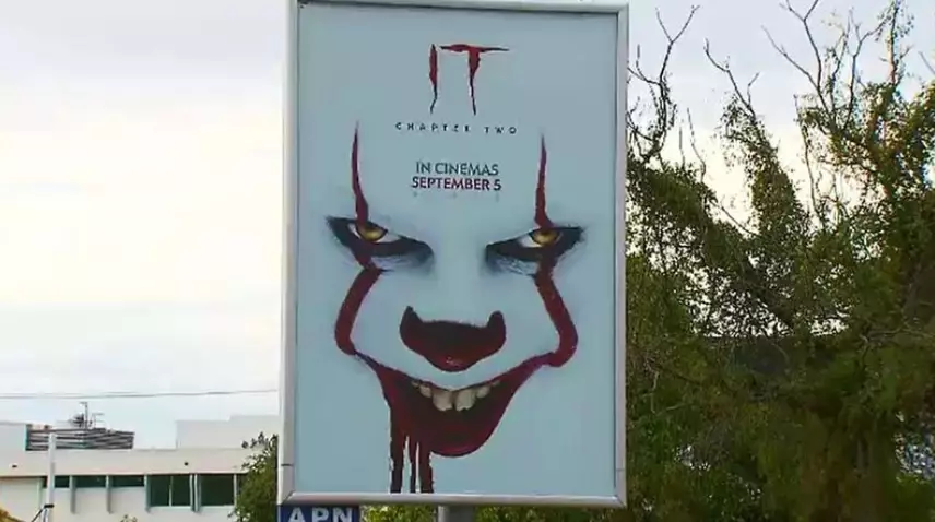 Pennywise's face on a unnervingly grand scale.