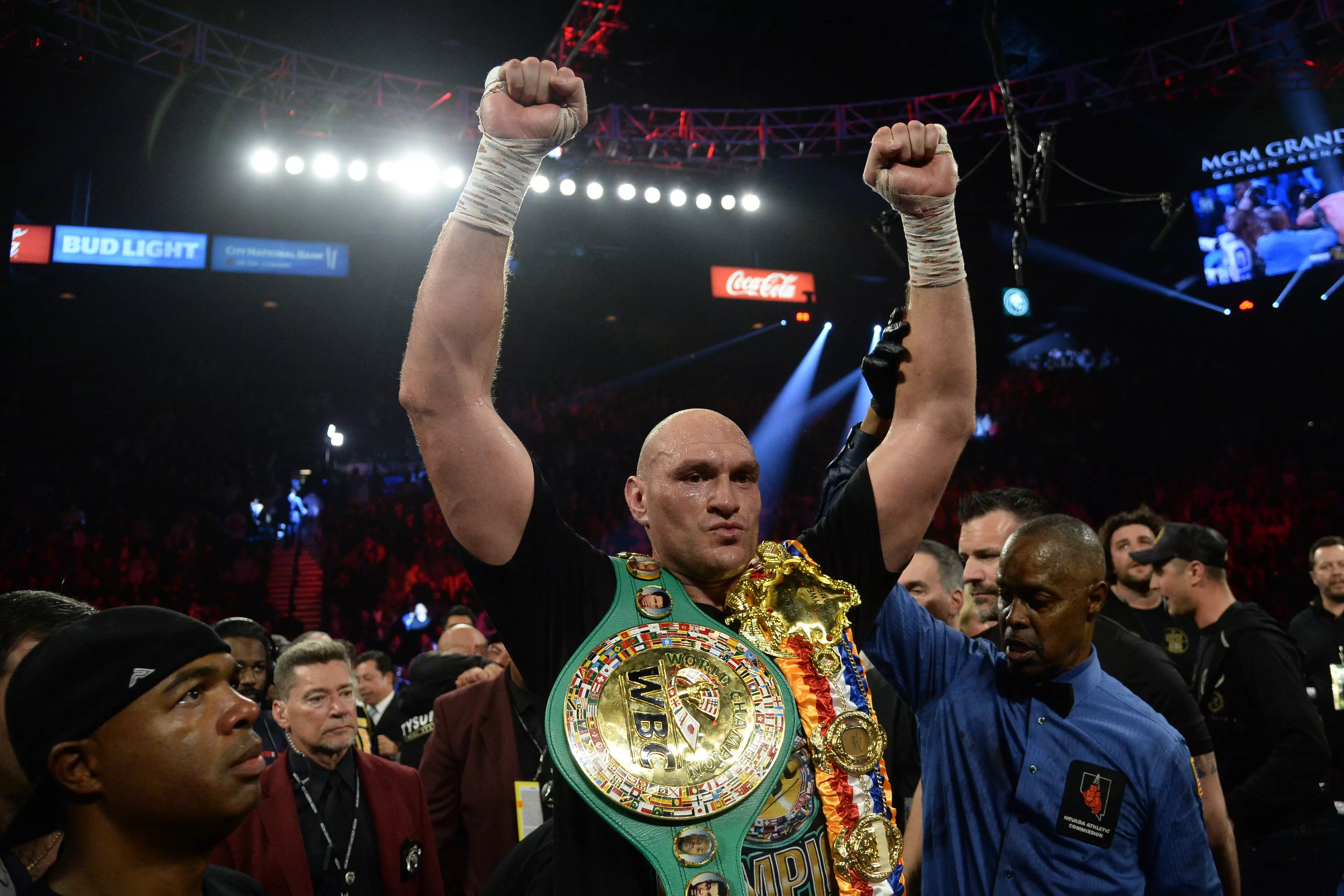 Fury celebrates with his new belts. Image: PA Images