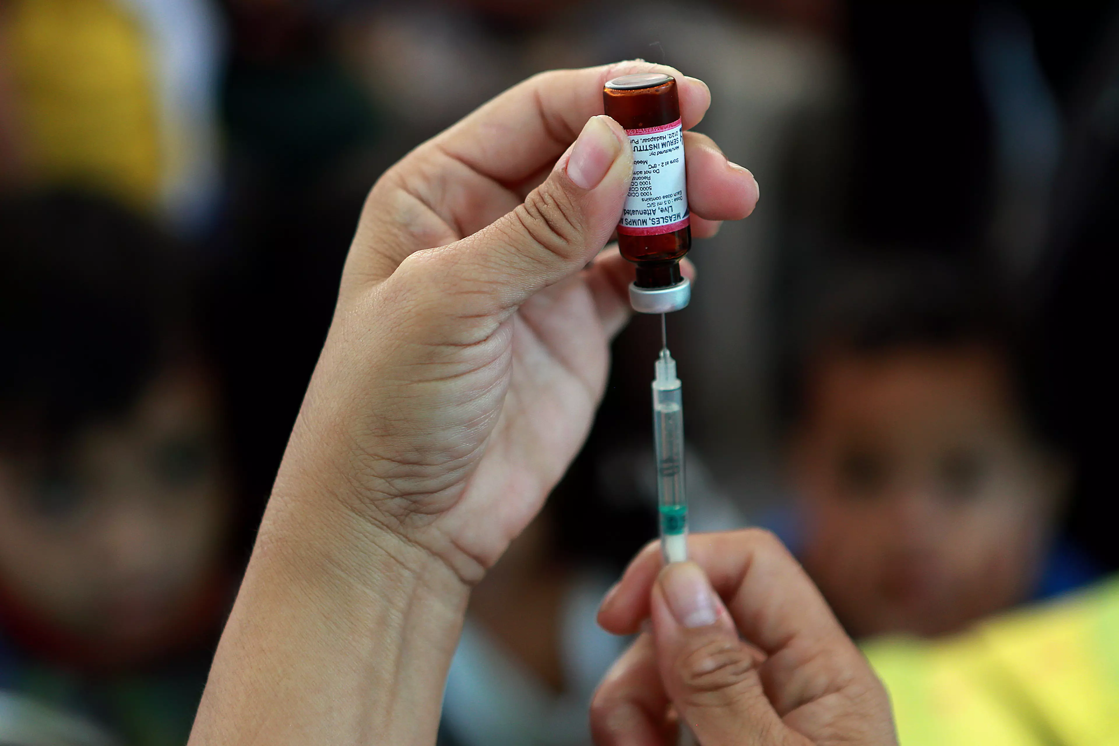 Doctor delivers much needed measles vaccine to people in the Philippines.