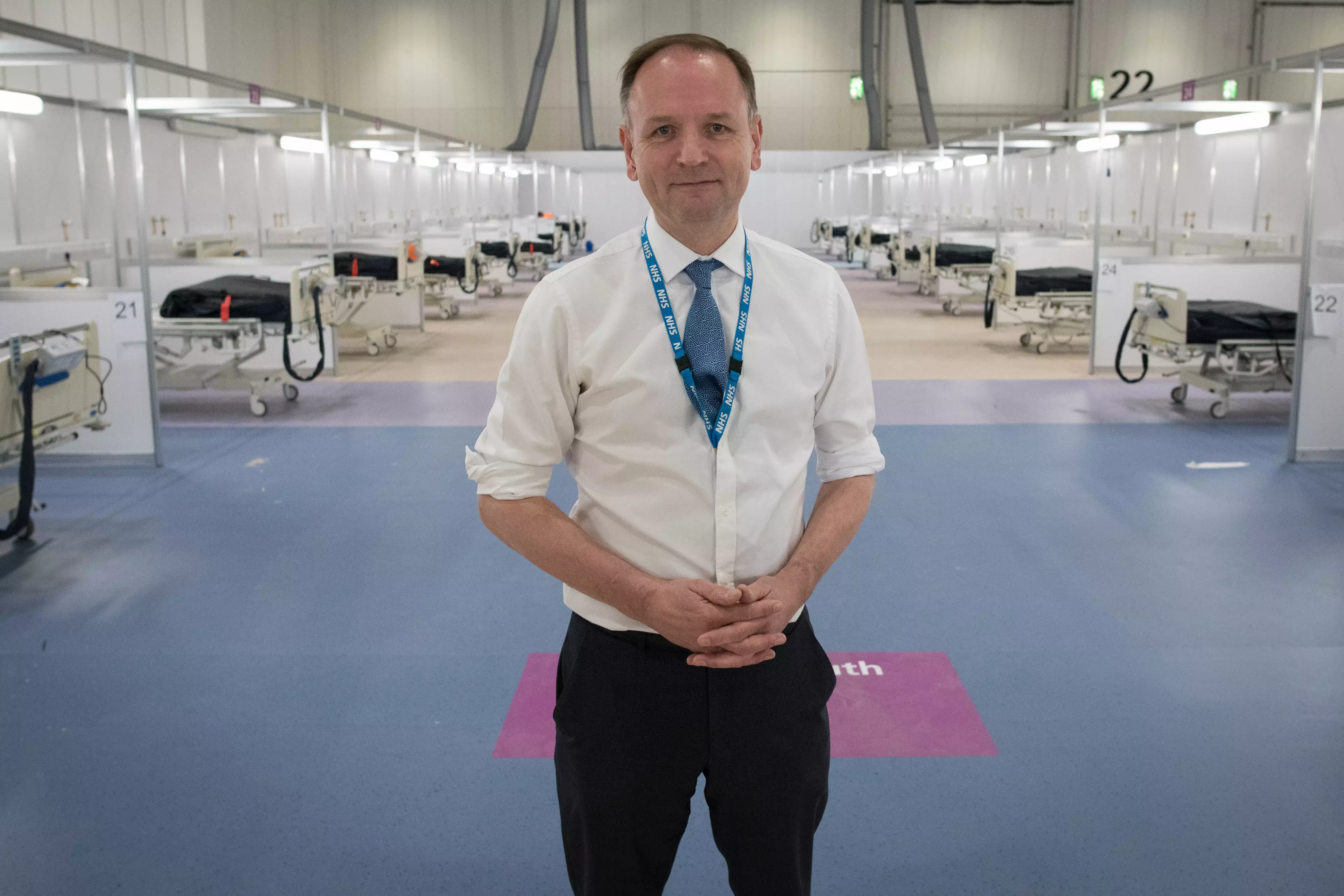 NHS England's chief executive Simon Stevens during a visit to the ExCel centre.