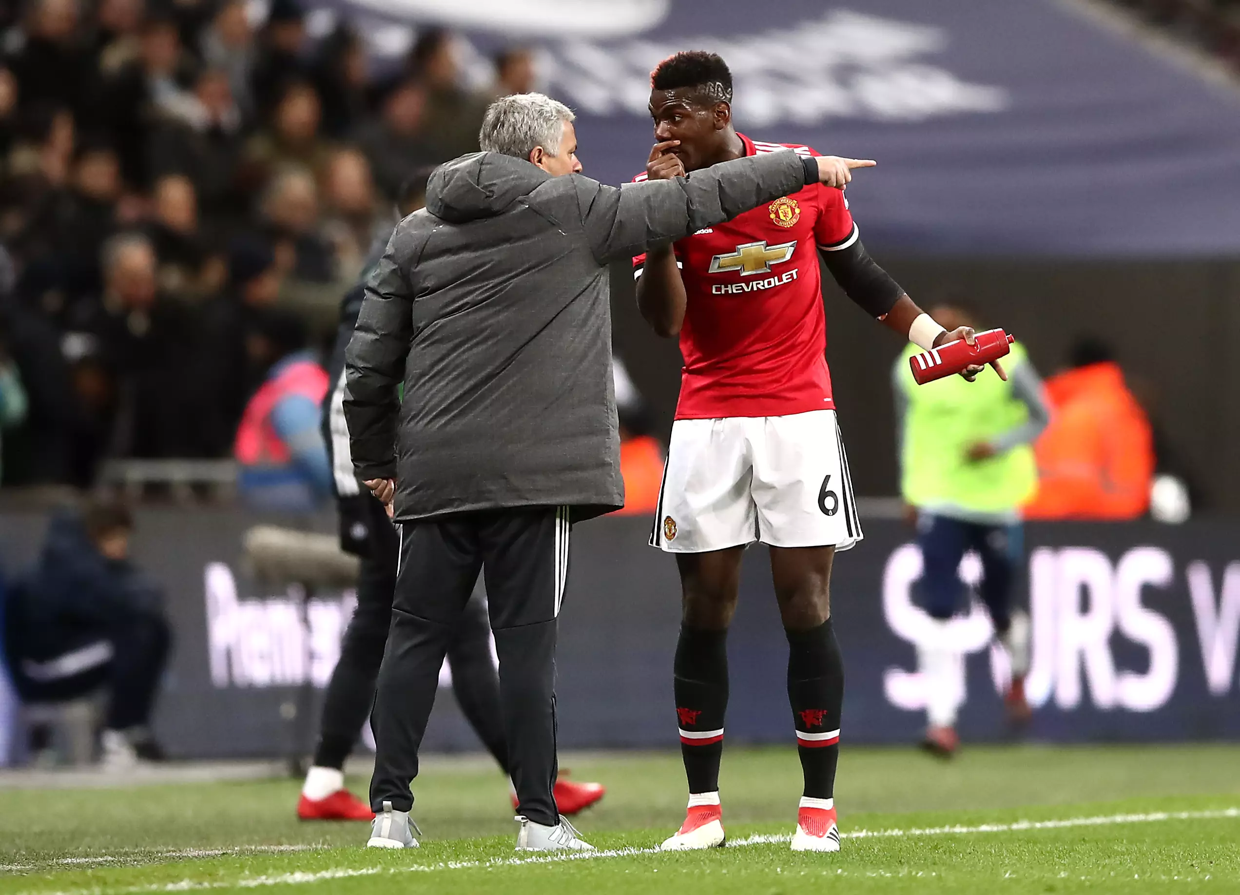 Mourinho and Pogba exchange words on the touchline. Image: PA