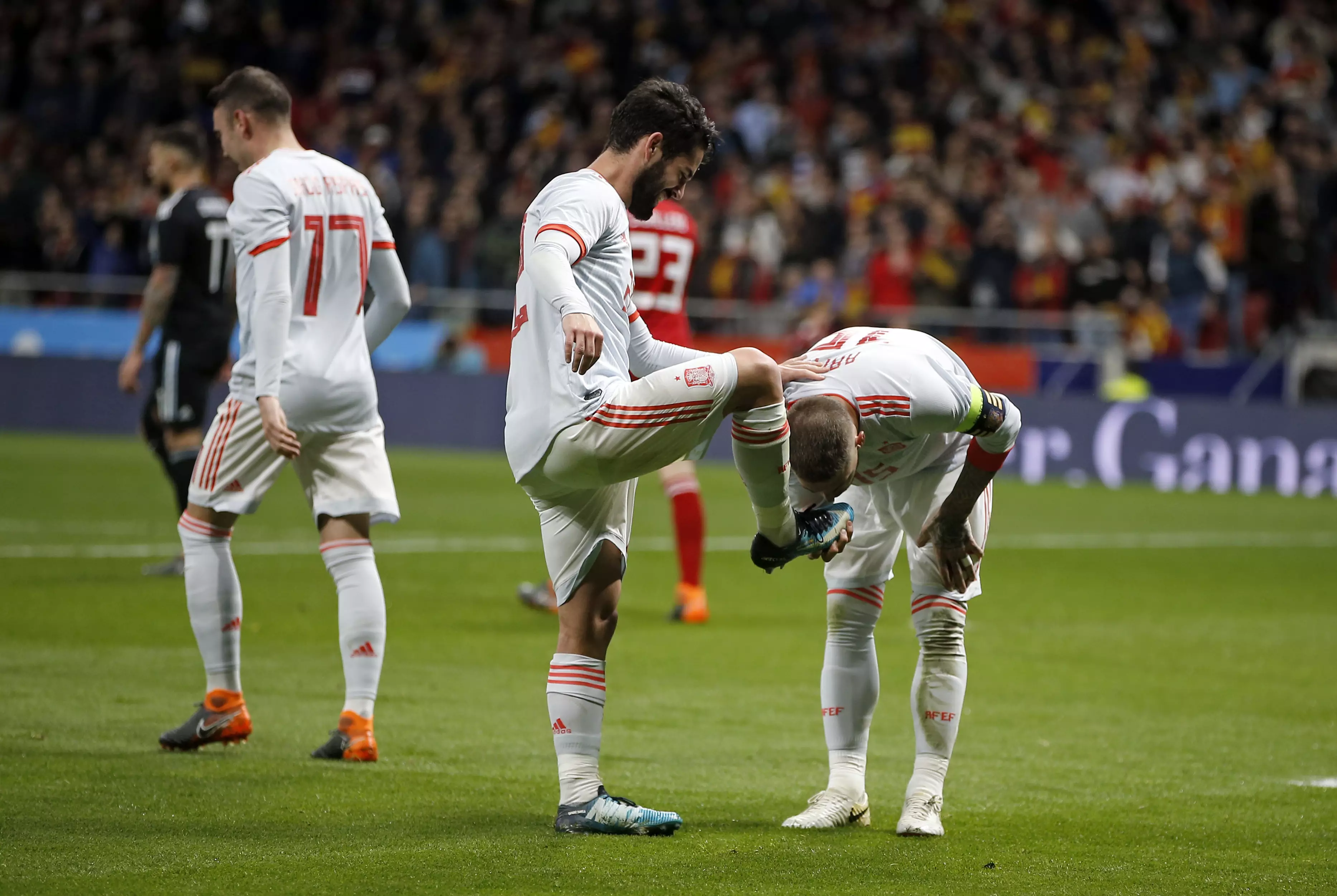 Sergio Ramos kisses the boot of Isco. Image: PA