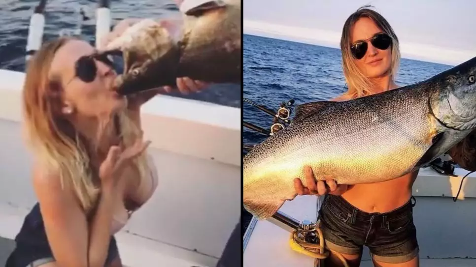 Woman Proudly Chugs Beer Out Of Dead Fishes Mouth