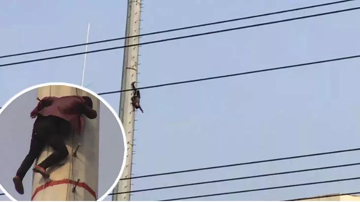 Man Hangs Upside Down After Scaling 100ft Phone Mast