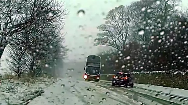 Quick-Thinking Bus Driver Narrowly Avoids Hitting Car On Icy Road