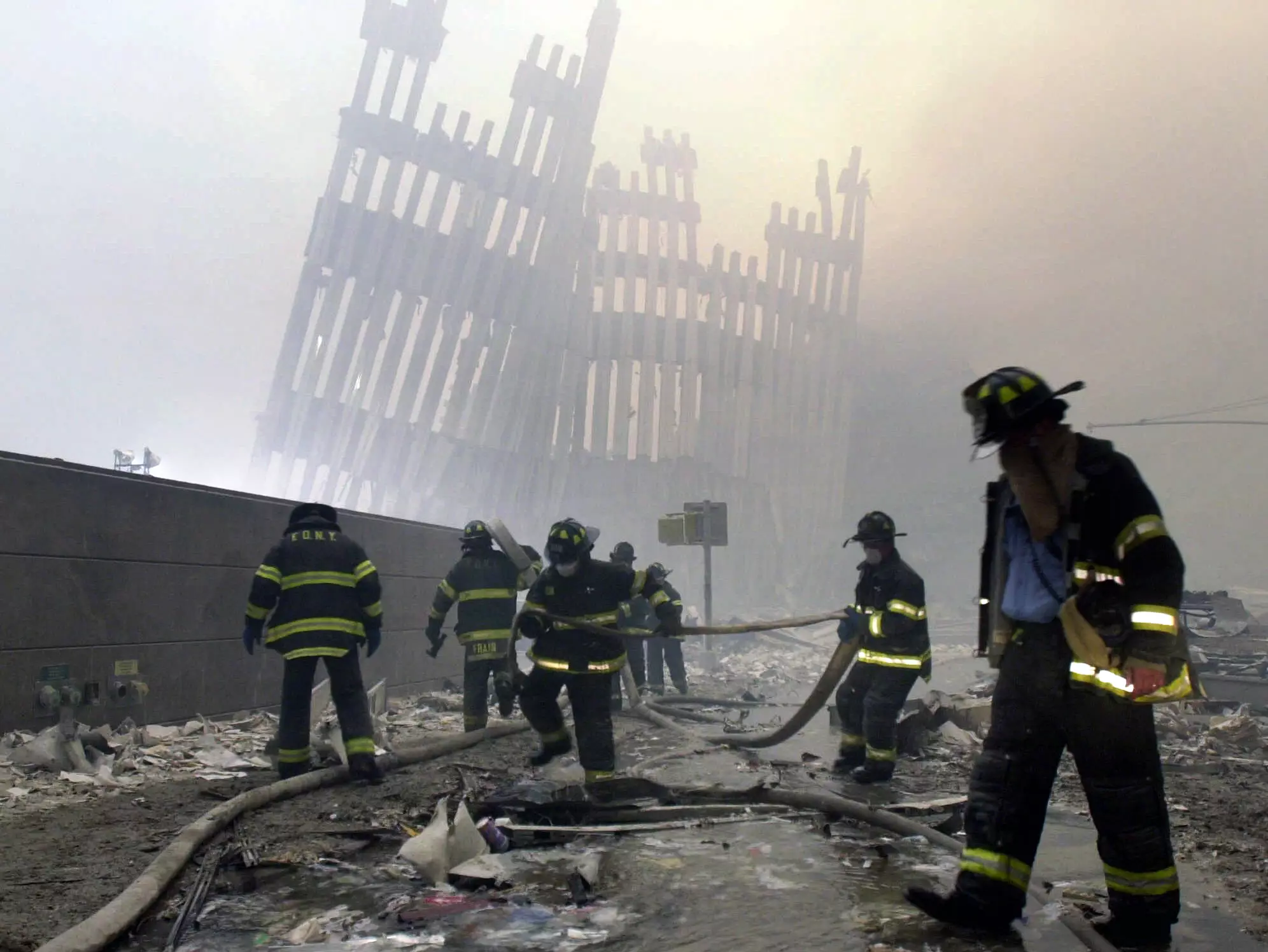 Firefighters and volunteers searching for survivors in the aftermath of the collapse of the twin towers.