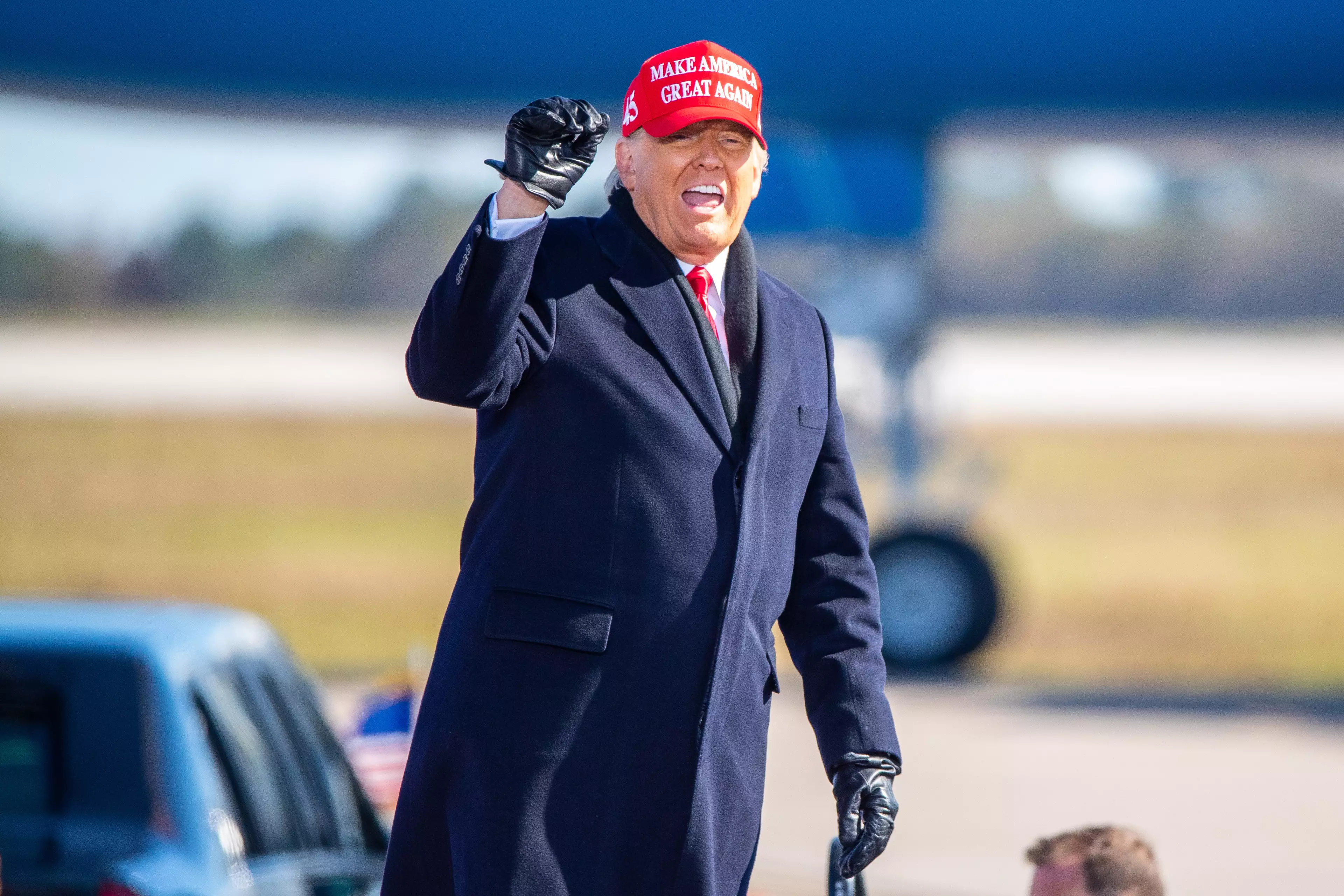 Trump wearing a 'MAGA' cap.