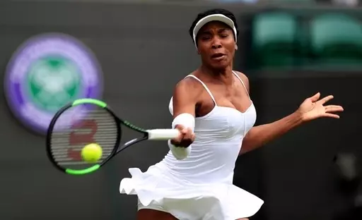 United States's Venus Williams returns to United States' Cori 'Coco' Gauff in a Women's singles match.