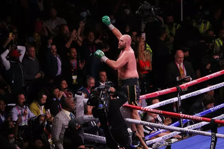 Fury celebrates retaining his WBC heavyweight belt.