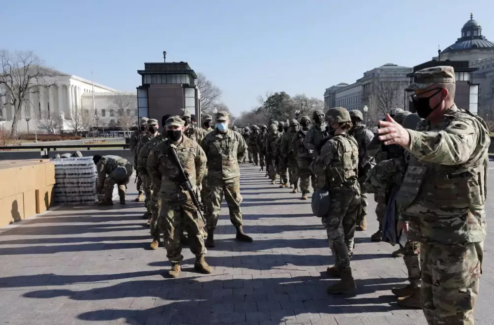 Members of the National Guard arrive on Capitol Hill during the Impeachment debate.