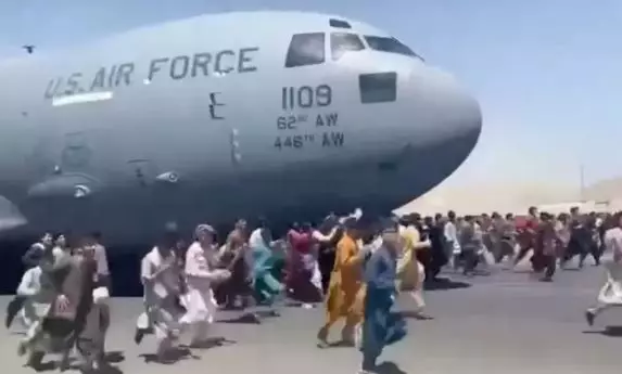 Hundreds of people clung onto the plane as it left Kabul.