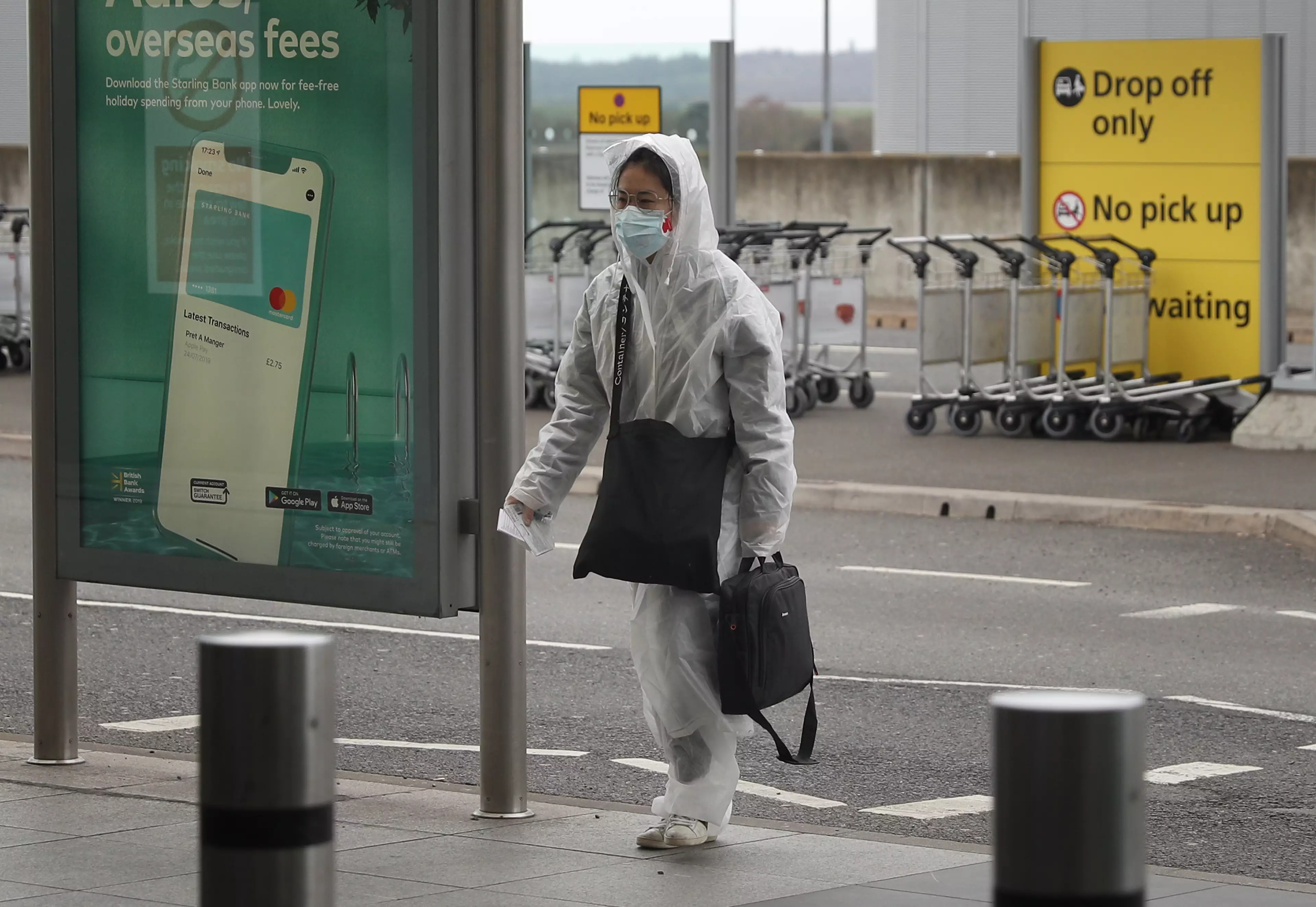 A passenger enters Terminal 5 at Heathrow.