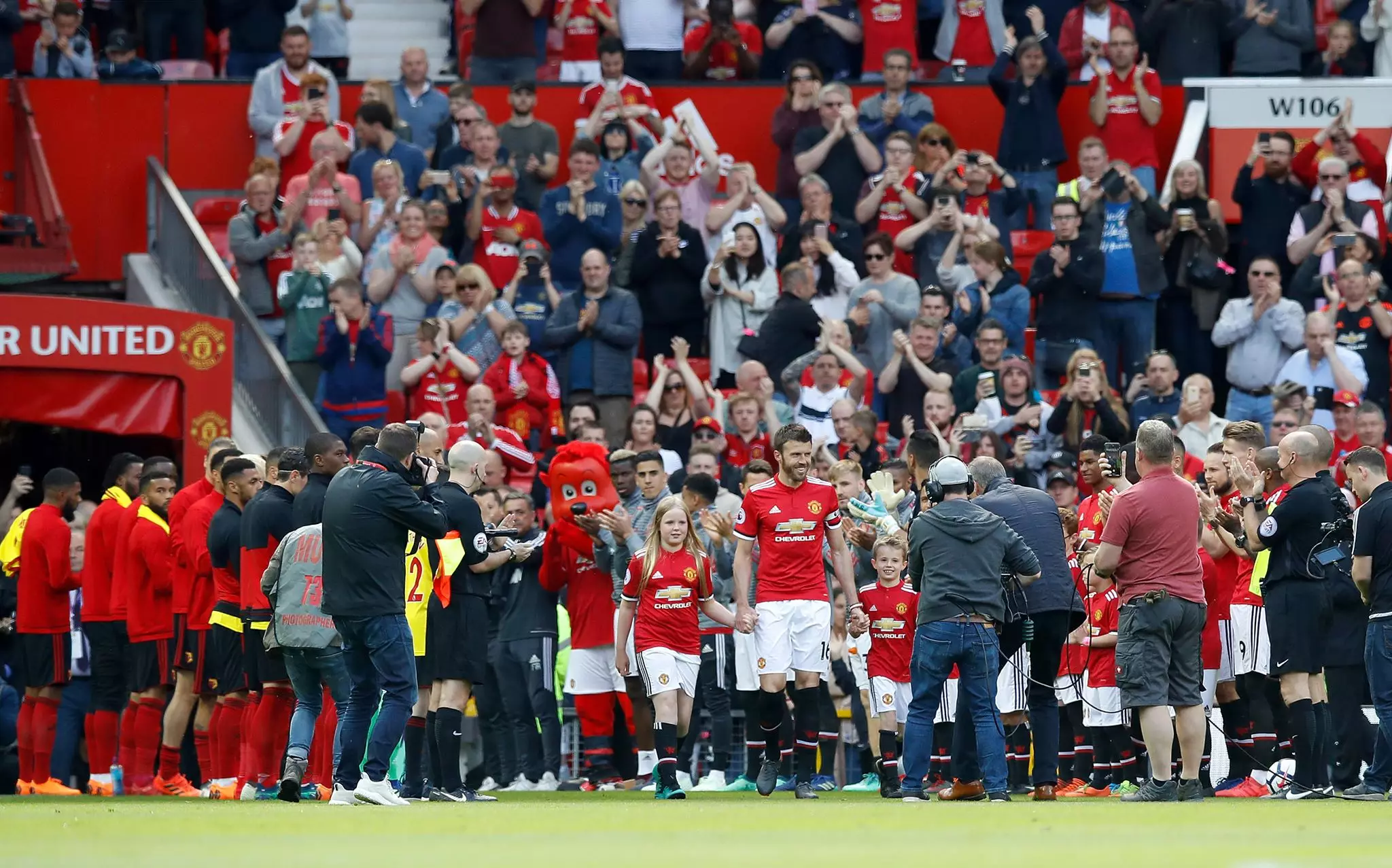 Carrick leads out the United team through a guard of honour. Image: PA