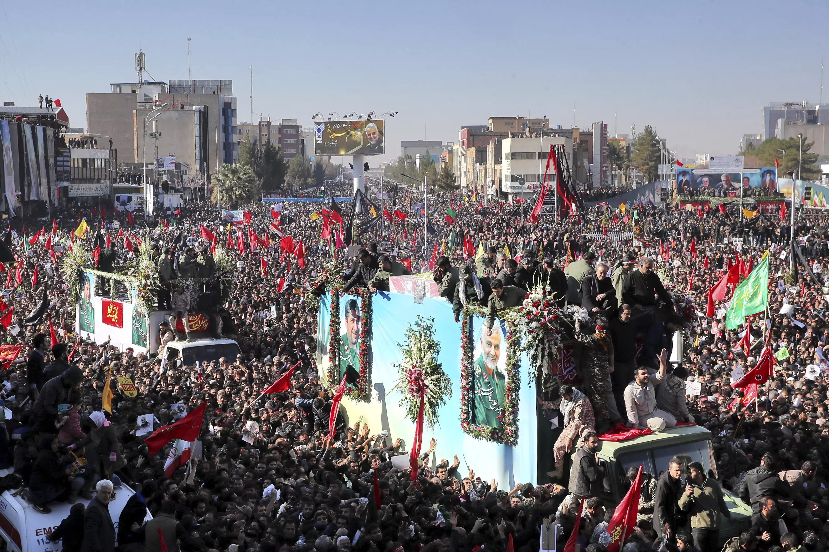 Thousands rally as Qassem Soleimani is carried through Iran.