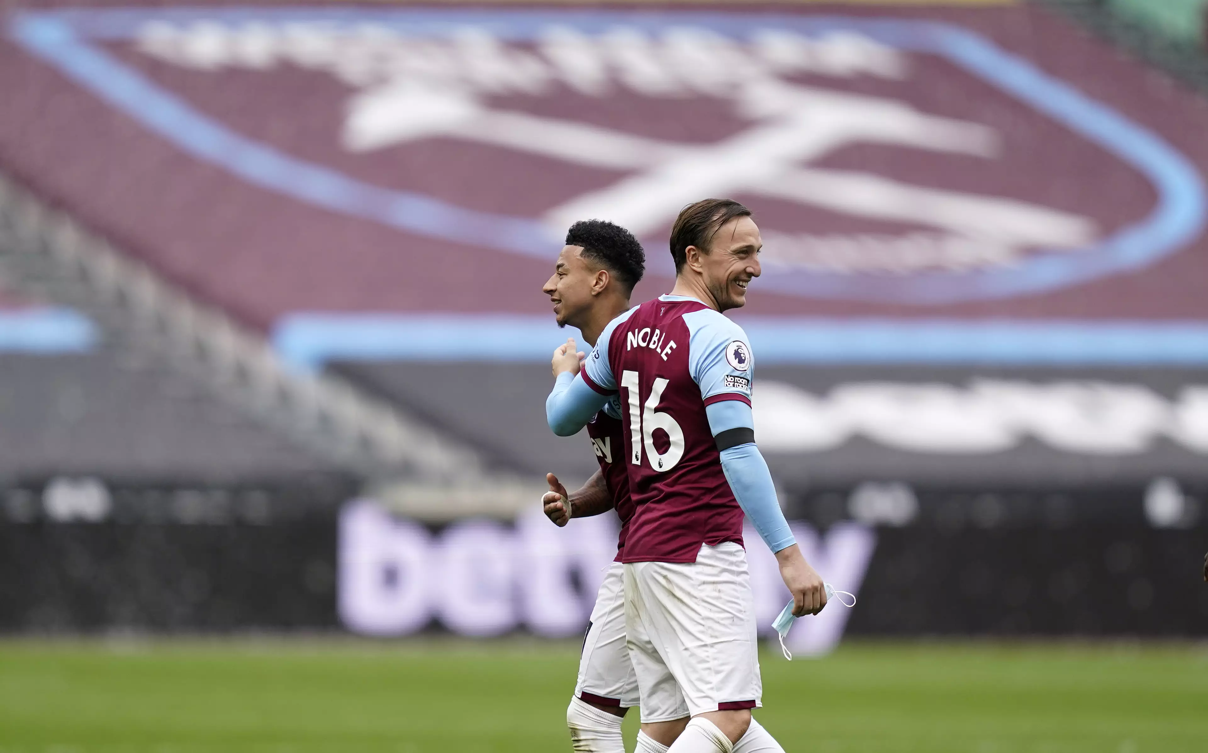 Noble begrudgingly celebrates with his teammate. Image: PA Images