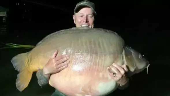 Angler Catches 8 Stone Mega Carp While On Holiday 