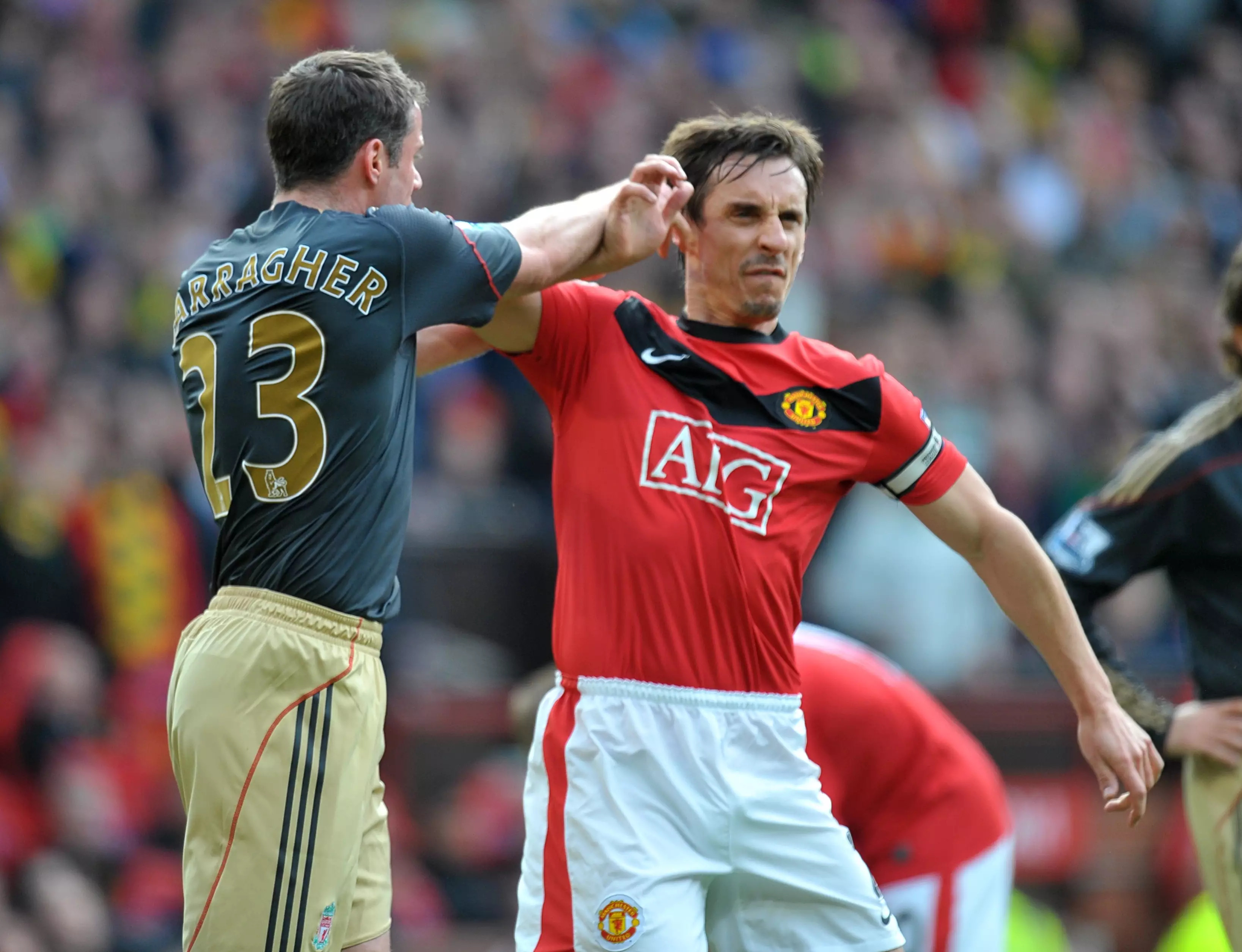 Gary Neville at his happiest - Scrapping with an angry Scouser. Images: PA