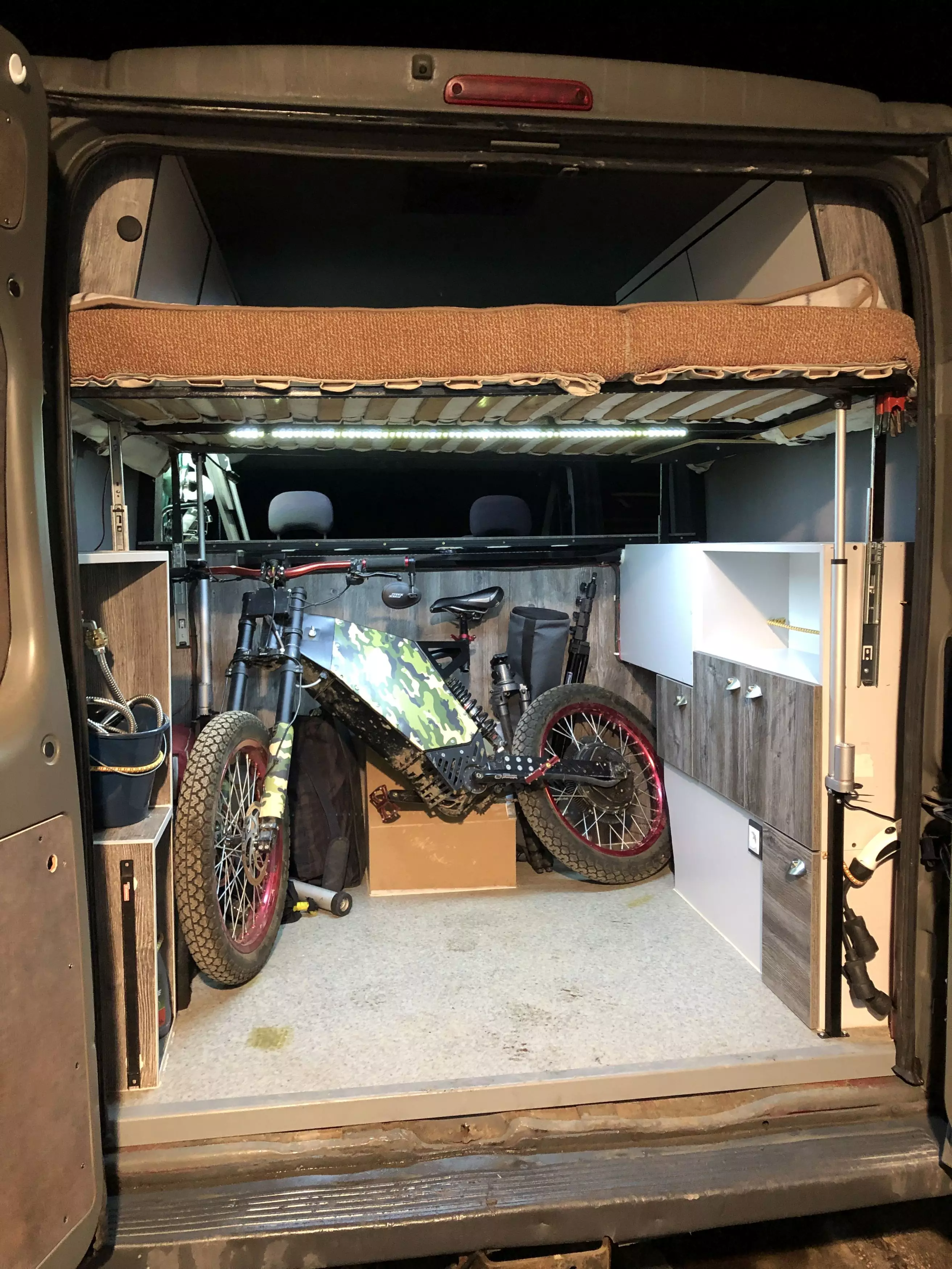 The van has a built in 'garage' to keep bikes.