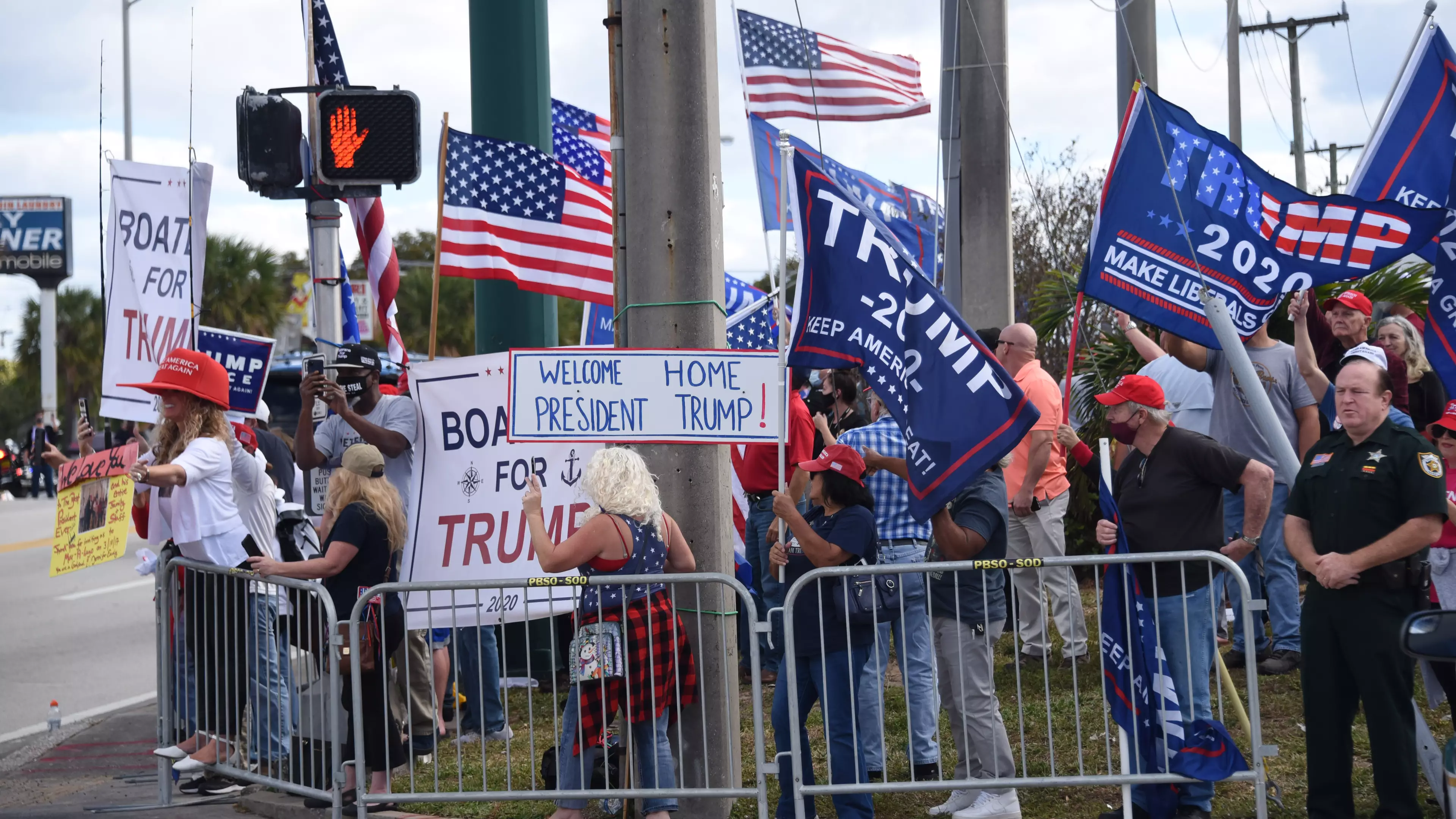 Supporters Line The Streets Welcome Trump Home As He Returns To Florida 