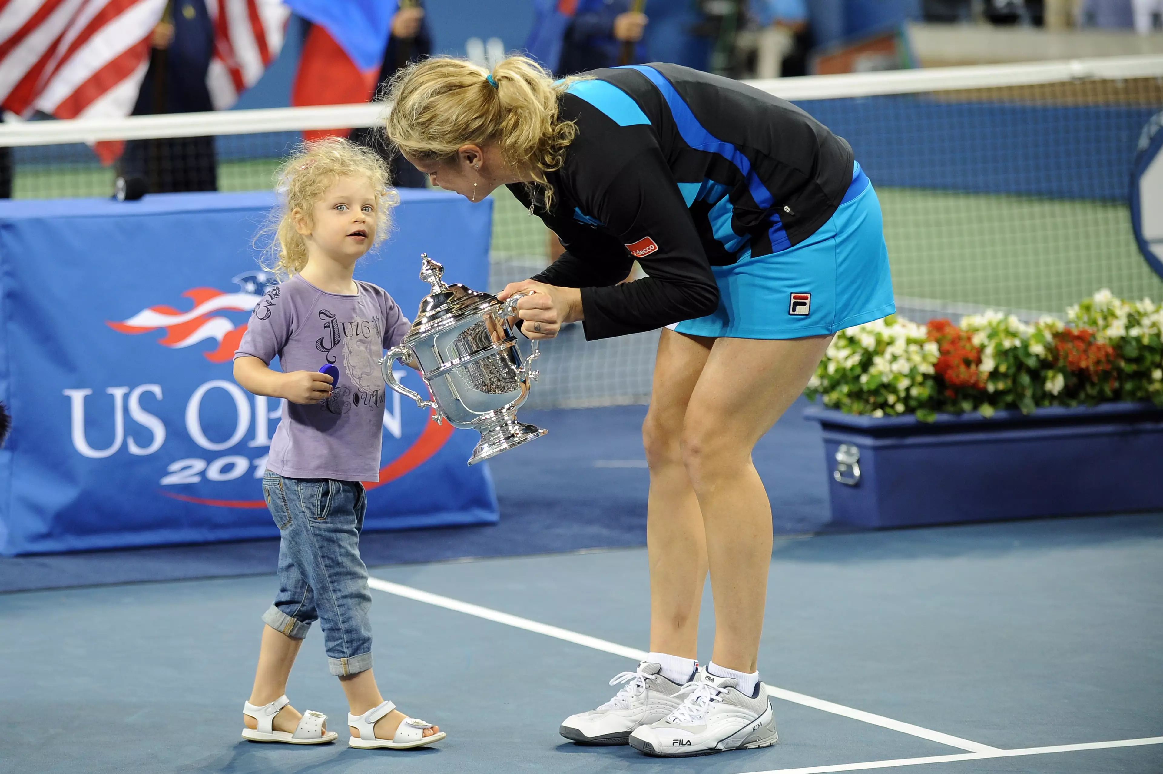 Clijsters is pictured with her daughter after winning the US Open. Credit PA