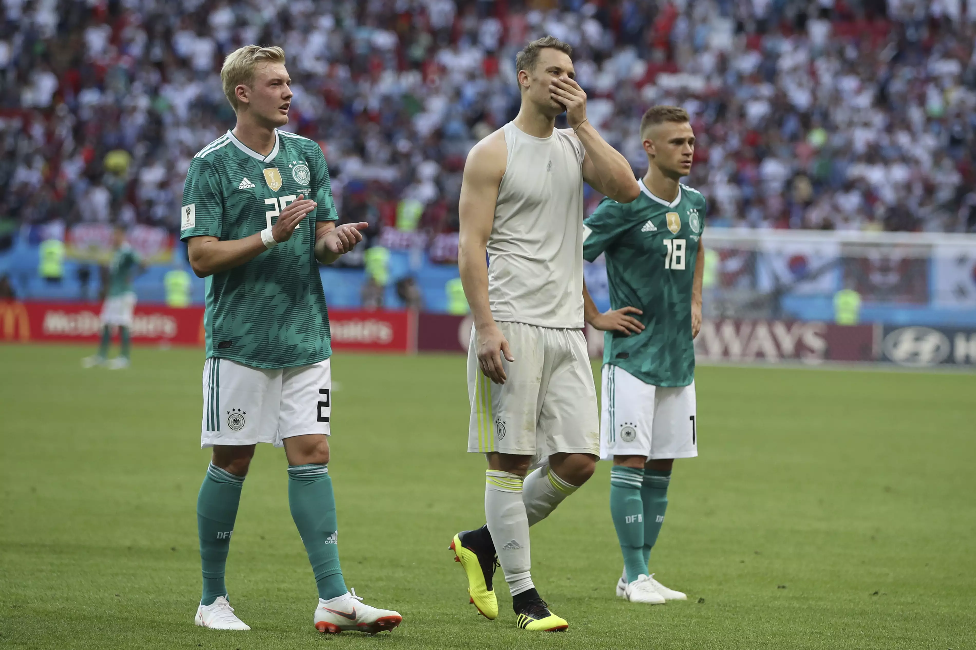 The German player walk off the pitch. Image: PA