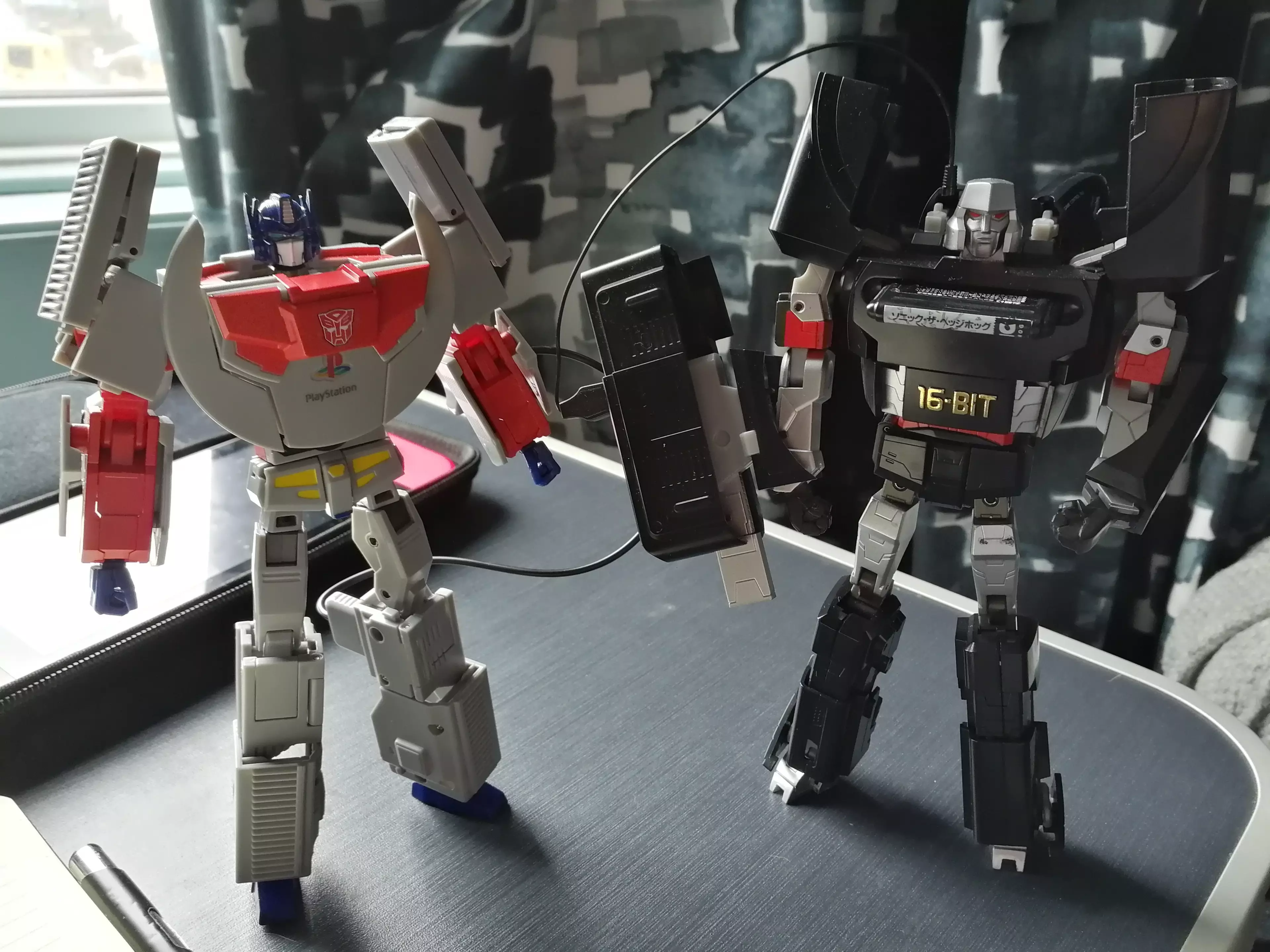 Both console bots, about to either battle or simply fall over