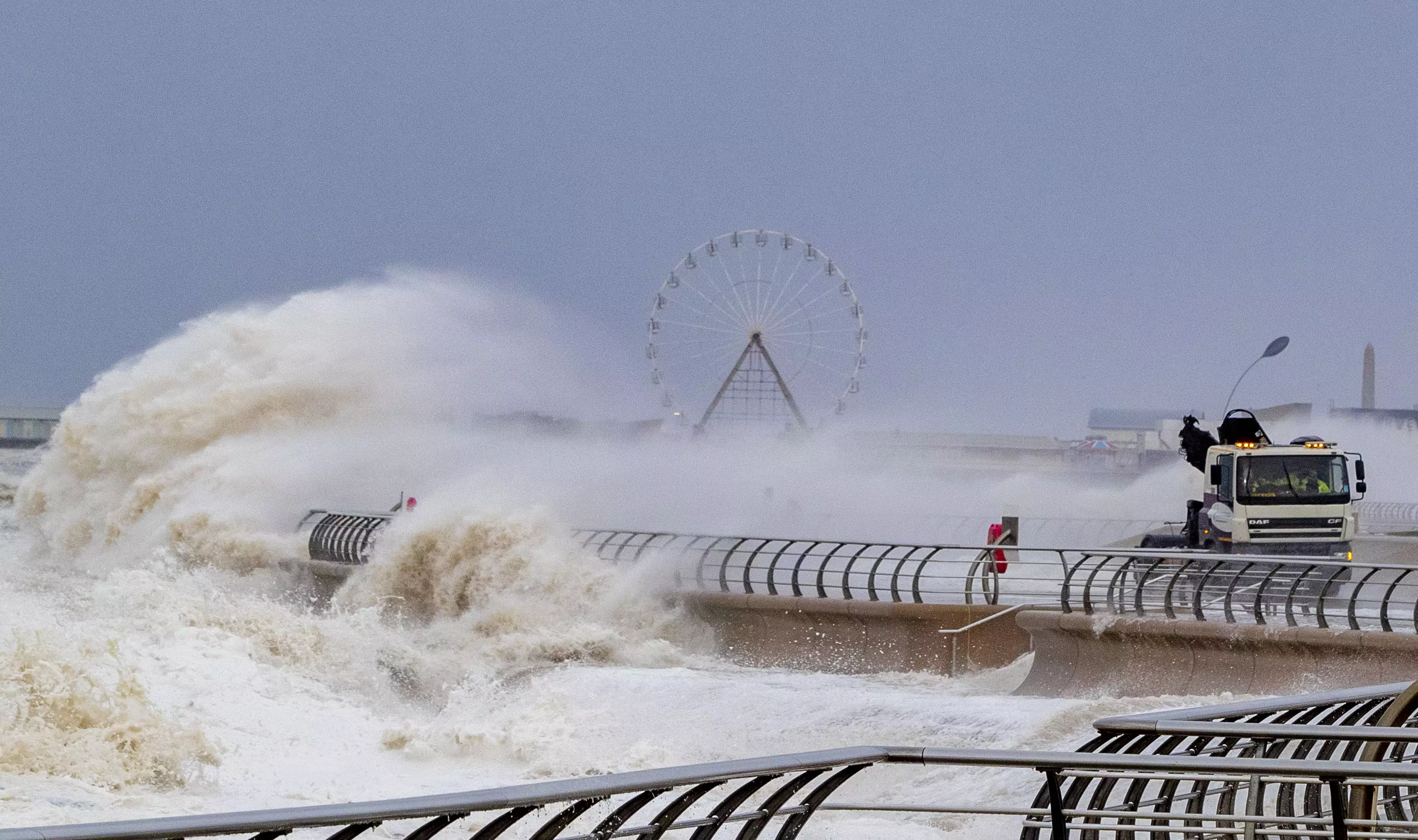 Waves crash over a lorry on Blackpool waterfront.