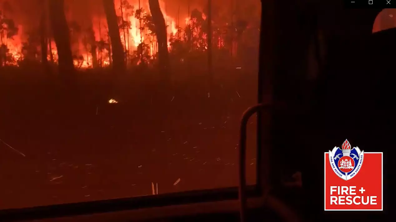 Terrifying Video Shows Australian Firefighters Driving Into Bushfire 