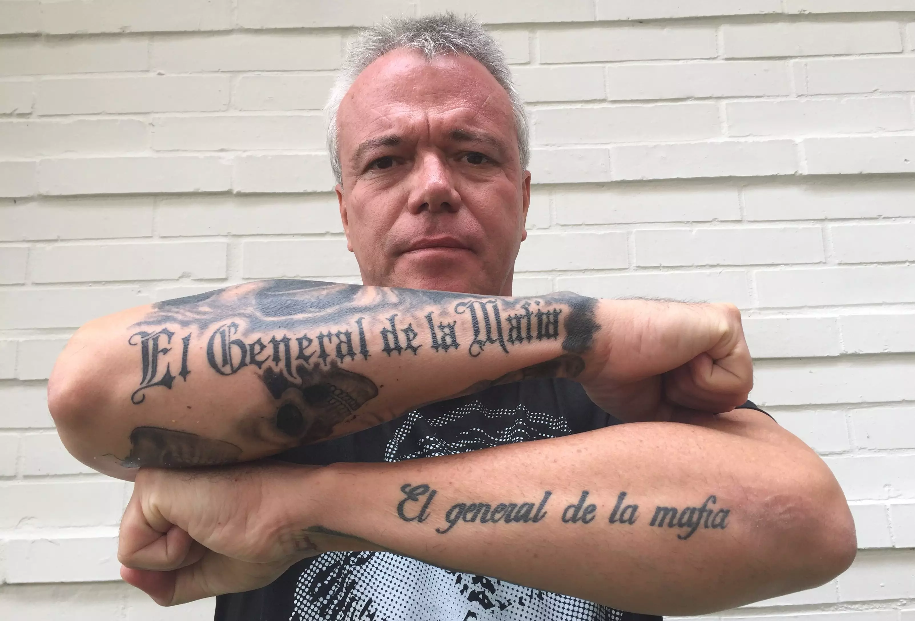 Popeye showing off his tattoos which read: 'El General de la Mafia' translation: The general of the mafia.