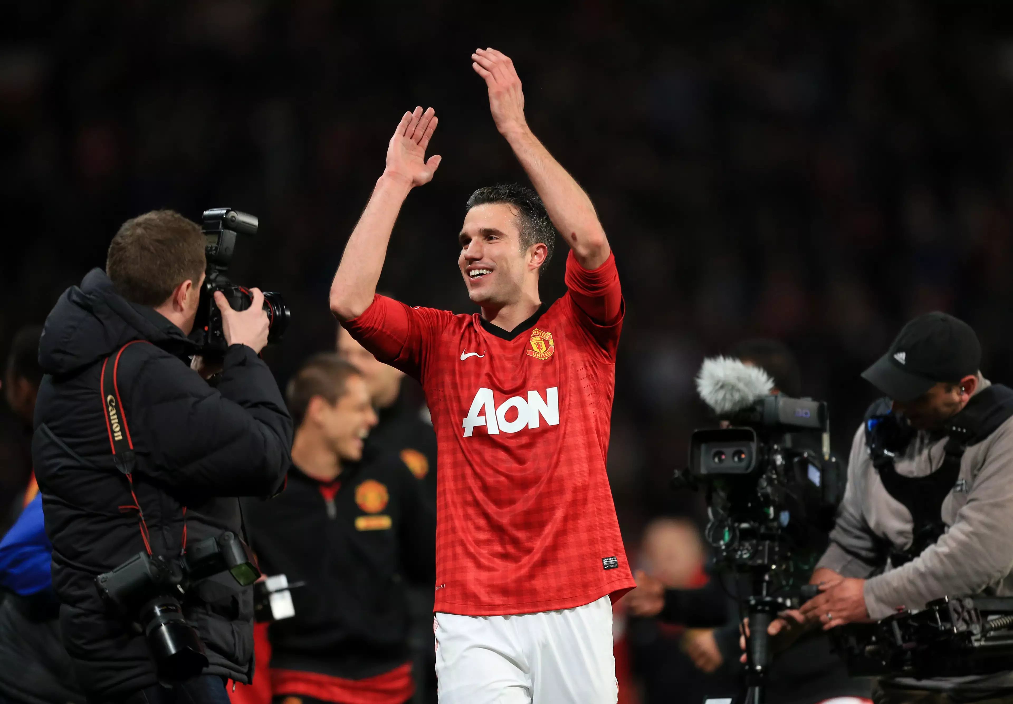 Van Persie celebrates winning the Premier League with United. Image: PA Images