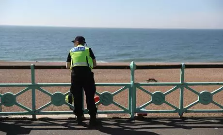 A police officer patrolling along Brighton Beach.